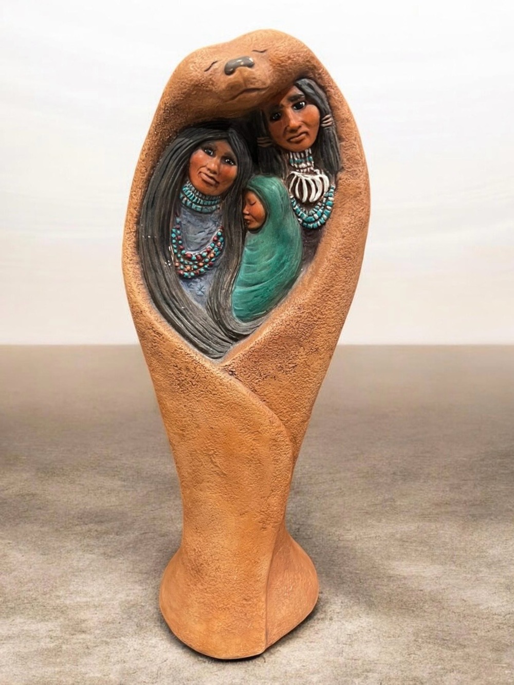 hand-painted ceramic bisque Native American family figurine sculpture.